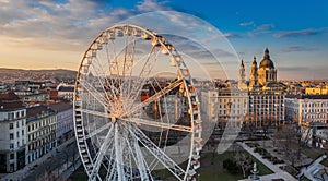 Budapest, Hungary - Aerial panoramic view of the ferris wheel at Elisabeth Square at sunset with St. Stephen`s Basilica