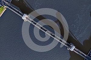 Budapest, Hungary - Aerial top down view of the famous Szechenyi Chain Bridge from above with bridge shadow silhouette on Danube