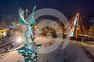 Budapest, Hungary - Aerial view of angel sculpture at Heroes` Square Hosok tere with Christmas decorated Andrassy street photo