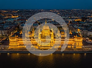 Budapest, Hungary - Aerial view of the beautiful illuminated Parliament of Hungary Orszaghaz at blue hour