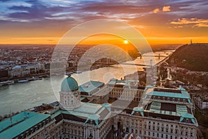 Budapest, Hungary - Aerial view of the dome of Buda Castle Royal palace at sunrise with Liberty Bridge, Elisabeth Bridge