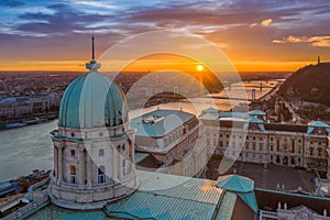 Budapest, Hungary - Aerial view of the dome of Buda Castle Royal palace at sunrise with Liberty Bridge, Elisabeth Bridge