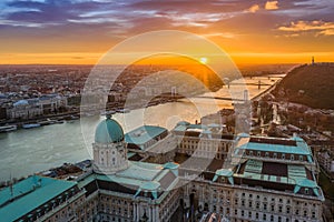 Budapest, Hungary - Aerial view of the dome of Buda Castle Royal palace at sunrise with Liberty Bridge
