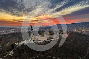 Budapest, Hungary - Aerial view of Gellert Hill, Citadel and Statue of Liberty with a fantastic colorful sunset