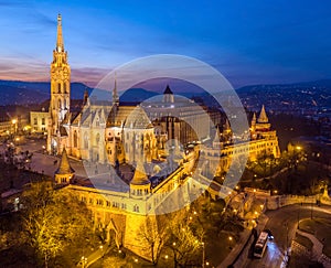 Budapest, Hungary - Aerial view of the illuminated Fisherman`s Bastion Halaszbastya and Matthias Church at dusk