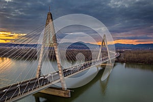 Budapest, Hungary - Aerial view of Megyeri Bridge over River Danube at sunset with heavy traffic