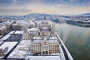 Budapest, Hungary - Aerial view of the Parliament of Hungary on a snowy december morning with Szechenyi Chain Bridge