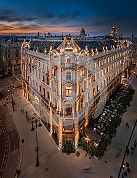 Budapest, Hungary - Aerial view of a renovated illuminated luxury collection hotel near Ferenciek tere after sunset photo