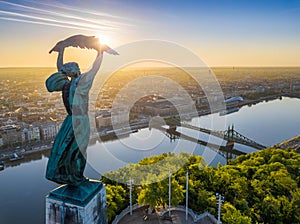 Budapest, Hungary - Aerial view from the top of Gellert Hill with Statue of Liberty, Liberty Bridge and skyline of Budapest