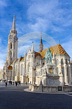 Budapest, Hungary - 01.23.2023: Beautiful Matyas templom Matthias church in Buda castle Budapest with blue sky