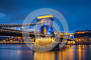 Budapest, Hungary - Beautiful Szechenyi Chain Bridge in unique blue colour with Buda Castle Royal Palace