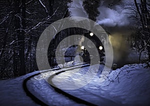 Budapest, Hungary - Beautiful winter forest scene with snow and old steam locomotive on the track in the Hungarian woods