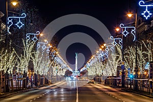 Budapest, Hungary - Christmas lights on Andrassy street with Heroes` Square at background photo