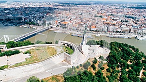 BUDAPEST/HUNGARY-circa June 2018: Aerial view of the Hungarian Statue of Liberty with Liberty Bridge on Danube river inBudapest,