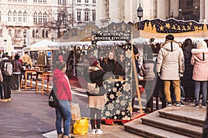 BUDAPEST, HUNGARY - DECEMBER 19, 2018: Tourists and local people enjoying the beautiful Christmas Market at St. Stephen's Square