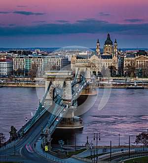 Budapest, Hungary - The famous Szechenyi Chain Bridge Lanchid at sunset decorated with national flags