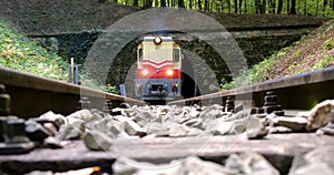 BUDAPEST, HUNGARY - FEB.19.2020: A diesel train chugs through a tunnel in a mountainside