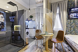 Budapest, Hungary - February 16, 2020: Luxurious tiny home space with a shower cabin outside the bathroom