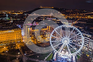 Budapest, Hungary - Illuminated ferris wheel at Elisabeth Square at the centre of Budapest with Statue of Liberty