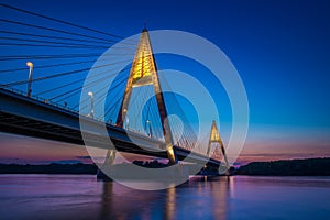 Budapest, Hungary - The illuminated Megyeri Bridge over river Danube at blue hour