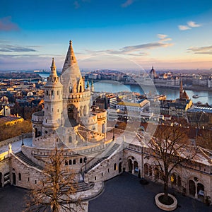 Budapest, Hungary - The main tower of the famous Fisherman`s Bastion Halaszbastya from above with Parliament