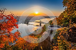 Budapest, Hungary - Panoramic skyline view of Budapest at sunrise with beautiful autumn foliage, Liberty Bridge