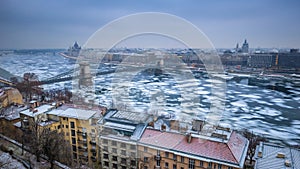 Budapest, Hungary - Panoramic skyline view of the Szechenyi Chain Bridge on the icy River Danube with Parliament and Bazilika