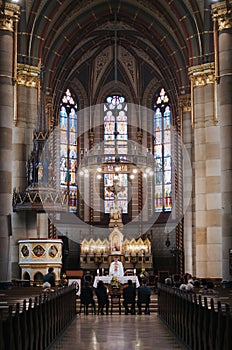 BUDAPEST, HUNGARY - SEPTEMBER 18, 2016: Parishioners and priest in church of St. Elizabeth of the House of ÃrpÃ¡d. The interior