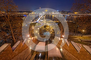 Budapest, Hungary - View from the Buda Castle Hill at blue hour with moving funiculars, Szechenyi Chain Bridge