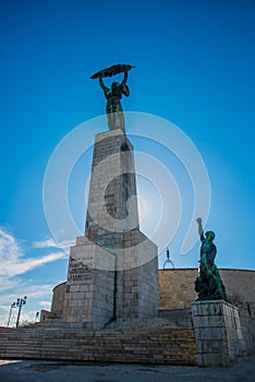 BUDAPEST, HUNGARY: Wide angle view of the Liberty Statue or Freedom Statue stands on Gellert Hill