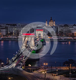 Budapest, Hungary - The world famous illuminated Szechenyi Chain Bridge Lanchid by night, lit up with national colors