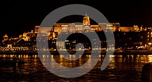 Budapest night cityscape over Danube river and the castle in the background.