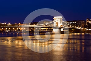 Budapest skyline, reflected on the river bridge.