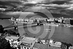 Budapest under storm clouds. The famous Chain Bridge across the Danube river. Budapest, Hungary