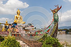 Buddah statue on boat on the Mekhong River