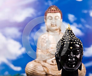 Buddha and blue sky background, vivid colors, natural tone