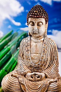 Buddha and blue sky background, vivid colors, natural tone