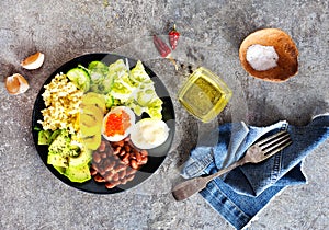 Buddha bowl, balanced food, vegetarian menu. Eggs, avocado, salad lettuce, bulgur, spice