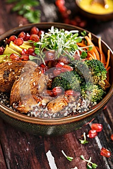 Buddha Bowl with Grilled Chicken, Broccoli, Quinoa, Carrots, Avocado and Turmeric sauce