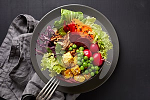 Buddha bowl, healthy and nutritious salad with a variety of vegetables, nuts and tofu cheese,delicious and nutritious vegan meal