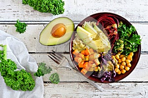 Healthy Buddha bowl on white wood. Top view scene.