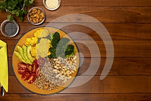 Buddha bowl on wooden table. Vegetarian and vegan food.