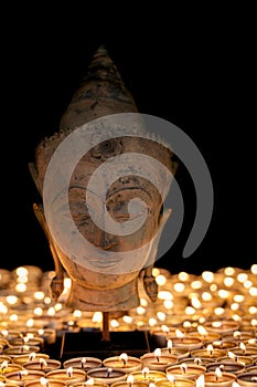 Buddha by candlelight. Enlightenment and mindfulness. Buddhist h