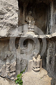 A Buddha carved in a cave of rocks