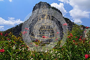 Buddha carved on cliff