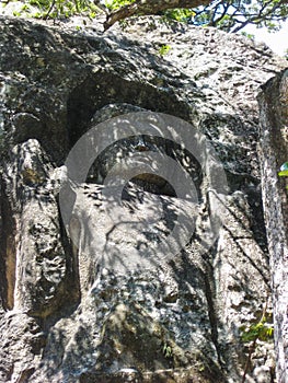 Buddha carved on mountain rock cliff Ã¢â¬Å The large unfinished Buddha image at Dhowa Raja Maha Vihara o photo