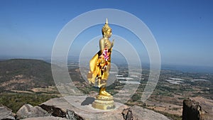 Buddha on cliff of Khao Phraya Doen Thong mountain at Phatthana Nikhom city in Lop Buri, Thailand