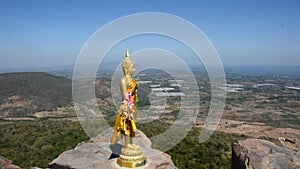 Buddha on cliff of Khao Phraya Doen Thong mountain at Phatthana Nikhom city in Lop Buri, Thailand