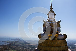 Buddha on cliff of Khao Phraya Doen Thong mountain for thai people travelers travel visit trail trekking go to respect praying