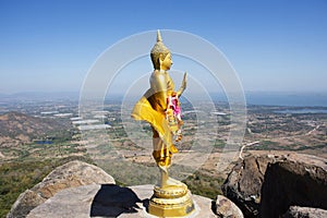 Buddha on cliff of Khao Phraya Doen Thong mountain for thai people travelers travel visit trail trekking go to respect praying